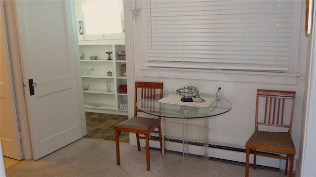 dining space with a baseboard radiator