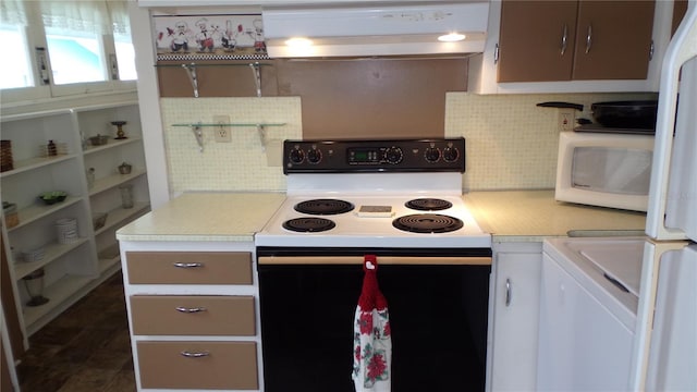 kitchen featuring white appliances and decorative backsplash