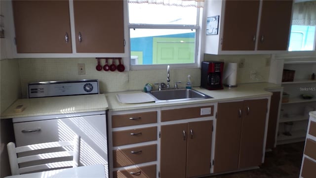 kitchen featuring sink and decorative backsplash