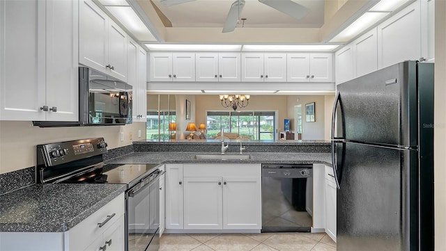 kitchen with ceiling fan with notable chandelier, sink, white cabinetry, and black appliances