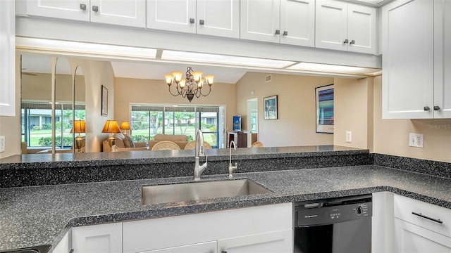 kitchen with white cabinetry, black dishwasher, sink, a notable chandelier, and vaulted ceiling