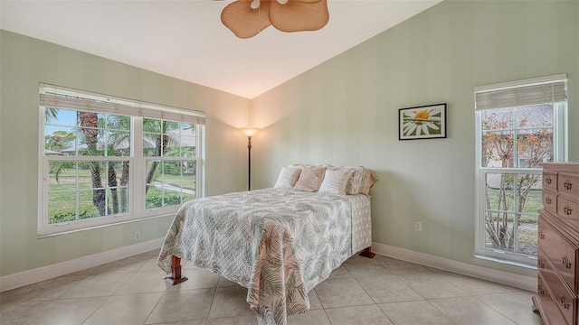 bedroom featuring vaulted ceiling, ceiling fan, and light tile patterned floors