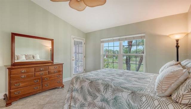 tiled bedroom with ceiling fan and vaulted ceiling