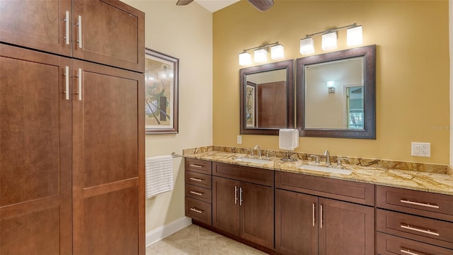 bathroom with tile patterned floors and vanity