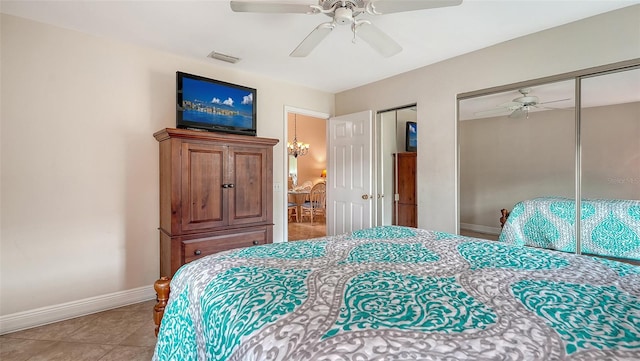 tiled bedroom with ceiling fan