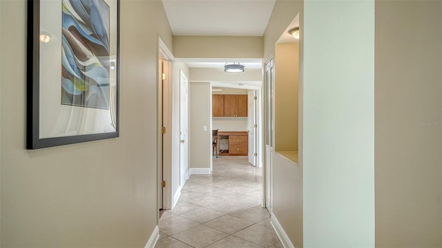 hall with light tile patterned flooring