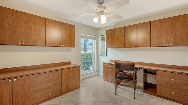 office space featuring ceiling fan and light tile patterned floors