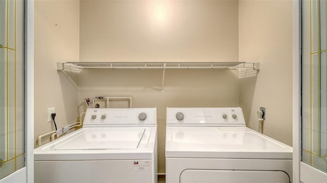 laundry room with washer and dryer