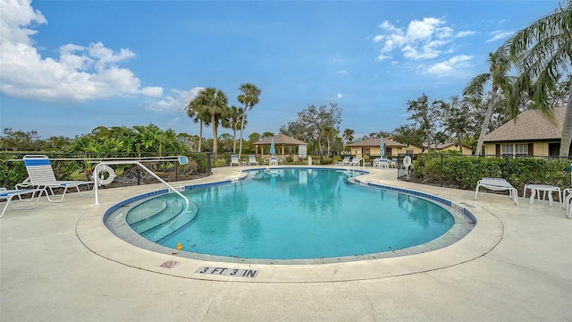 view of pool with a gazebo and a patio