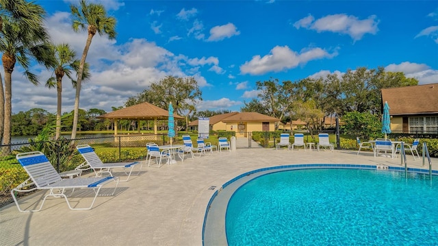 view of swimming pool featuring a patio area and a gazebo