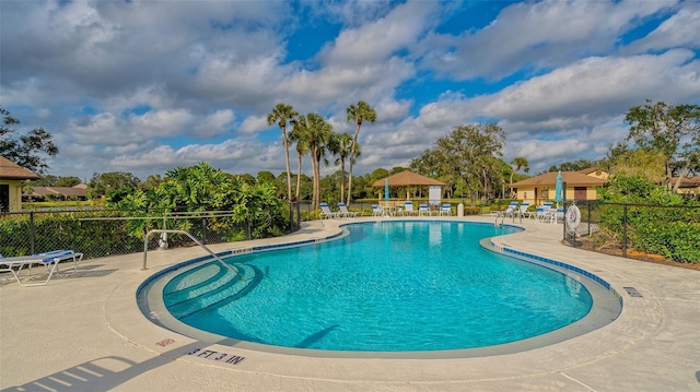 view of swimming pool with a patio