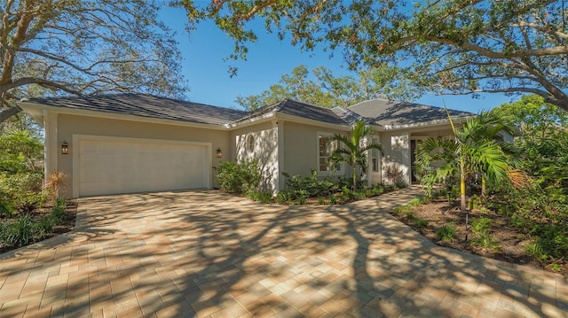 single story home with a garage