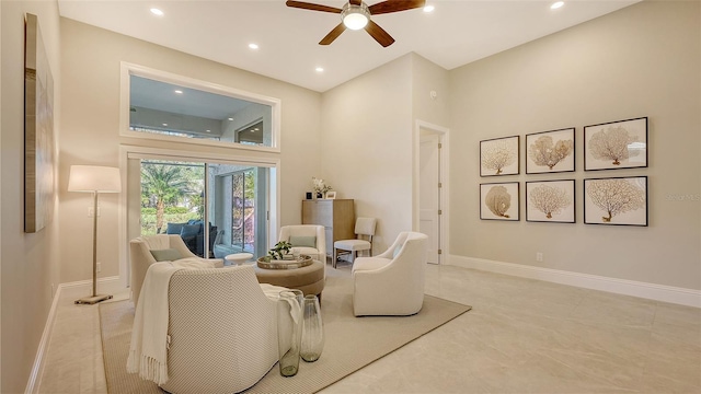 living area with ceiling fan