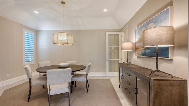 dining area with vaulted ceiling