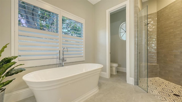 bathroom featuring separate shower and tub and toilet