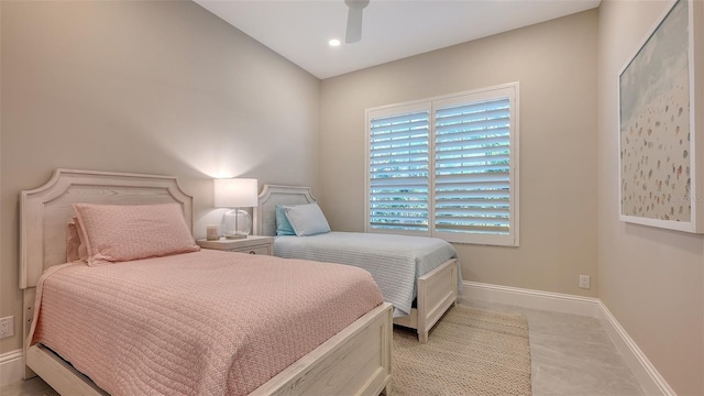 bedroom featuring ceiling fan and light carpet