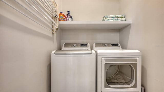 clothes washing area featuring washing machine and clothes dryer