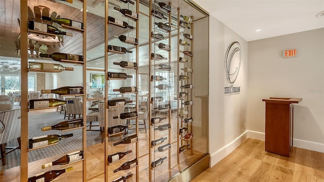 wine area with light hardwood / wood-style flooring