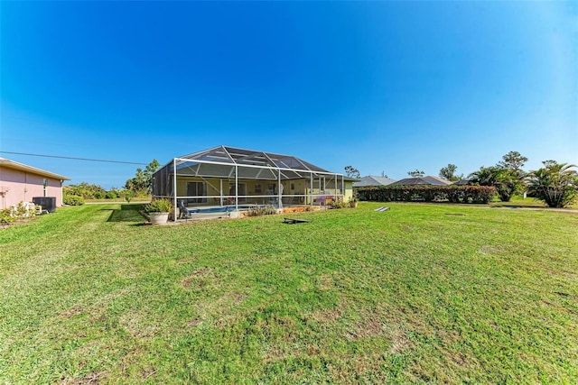 view of yard featuring glass enclosure