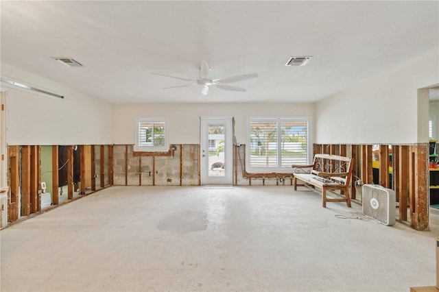 unfurnished room with a wealth of natural light and ceiling fan