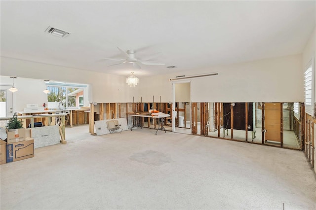 misc room with ceiling fan and carpet flooring