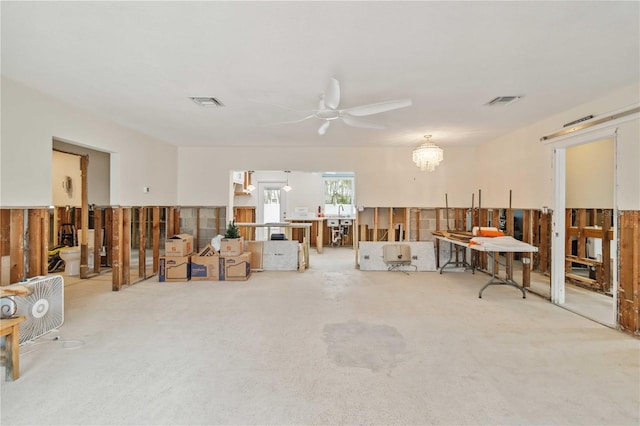 misc room with ceiling fan and carpet flooring