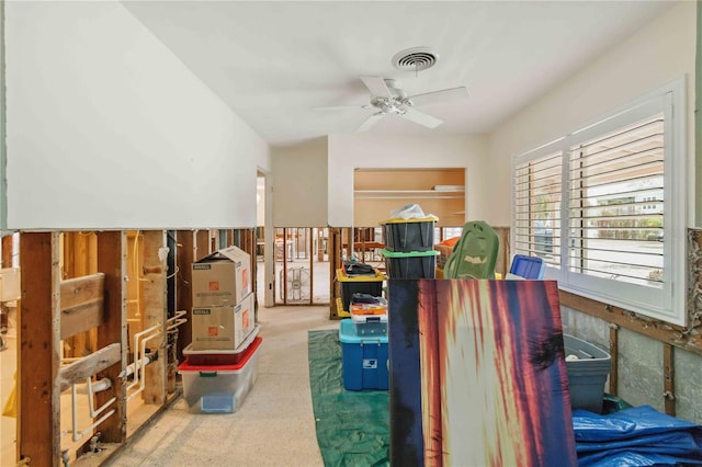 interior space featuring ceiling fan