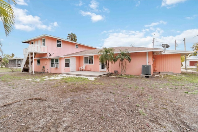 rear view of house featuring cooling unit, central AC, and a patio