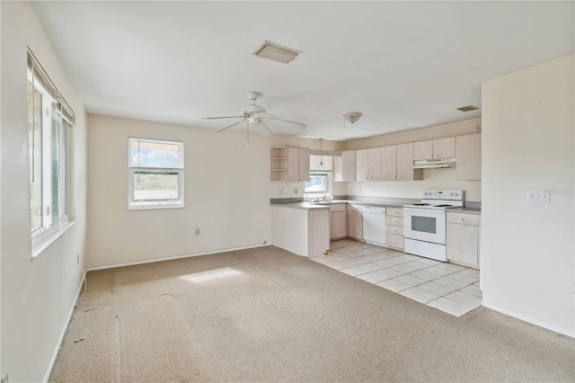 kitchen featuring light carpet, sink, white appliances, and ceiling fan