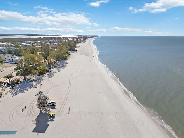 birds eye view of property featuring a water view and a view of the beach