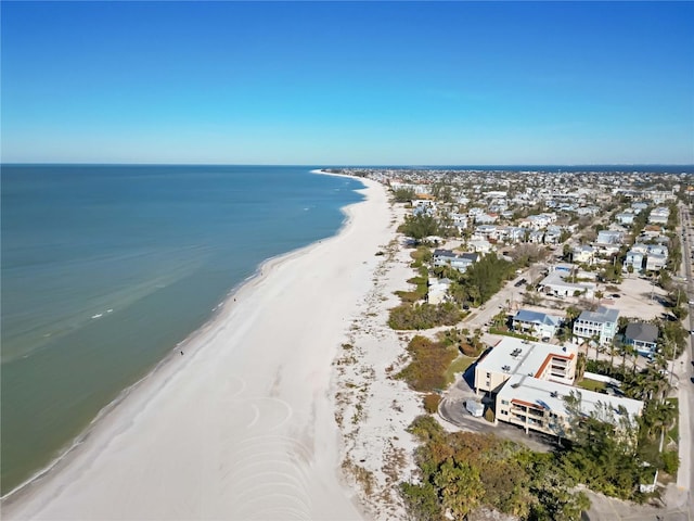 drone / aerial view featuring a view of the beach and a water view