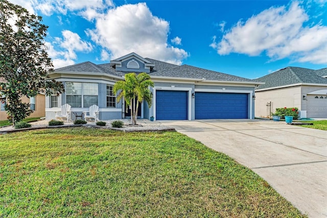 single story home featuring a garage and a front lawn