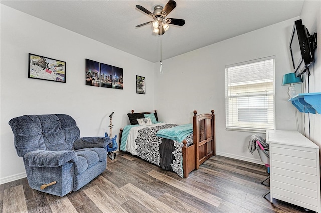 bedroom featuring ceiling fan and hardwood / wood-style floors