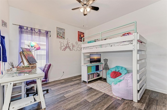 bedroom with ceiling fan and dark wood-type flooring