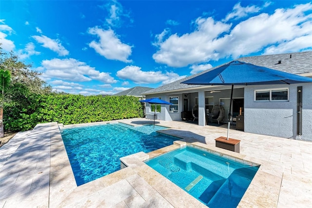 view of swimming pool with a patio area, ceiling fan, and an in ground hot tub