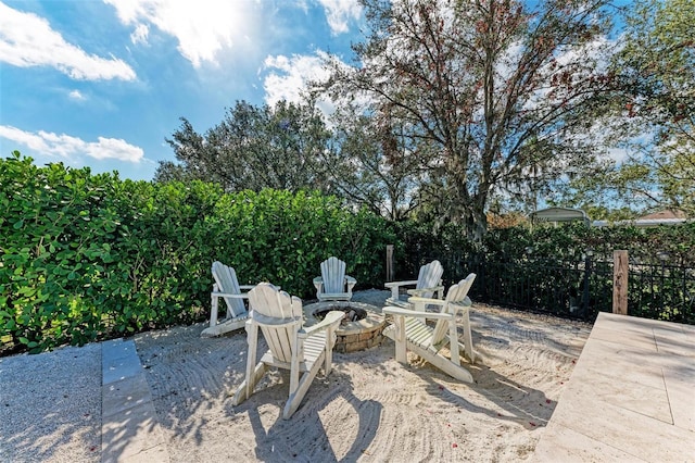 view of patio with a fire pit