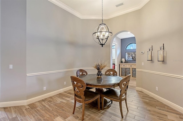 dining room featuring a chandelier and ornamental molding