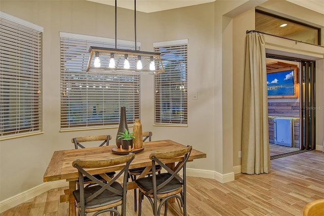 dining space featuring light wood-type flooring