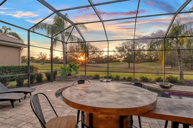 patio terrace at dusk with glass enclosure