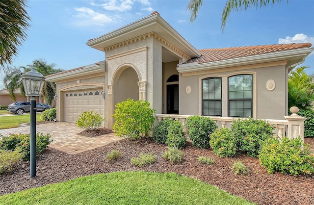 mediterranean / spanish-style home featuring a garage