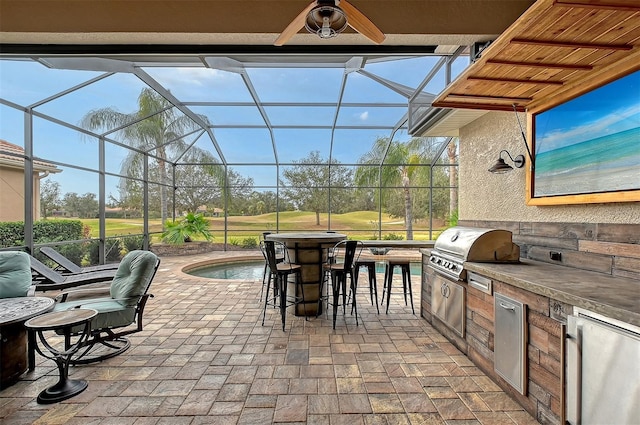 view of patio featuring a lanai, grilling area, exterior kitchen, and an outdoor bar