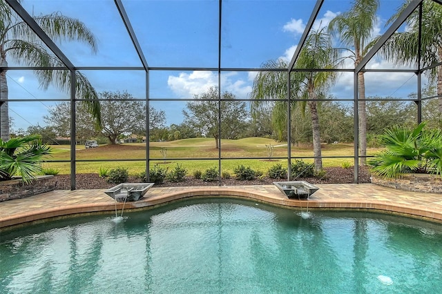 view of swimming pool featuring glass enclosure, a patio area, and pool water feature