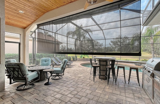 view of patio / terrace featuring a lanai and area for grilling