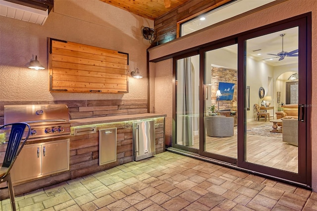 kitchen with ceiling fan and high quality fridge