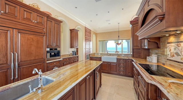 kitchen with backsplash, black electric stovetop, sink, a water view, and wood counters