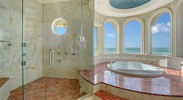 bathroom with an enclosed shower and a water view