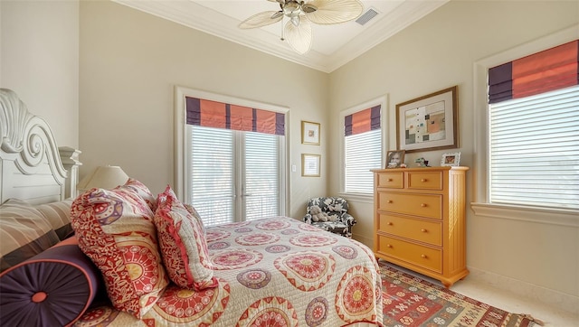 carpeted bedroom with ceiling fan and ornamental molding