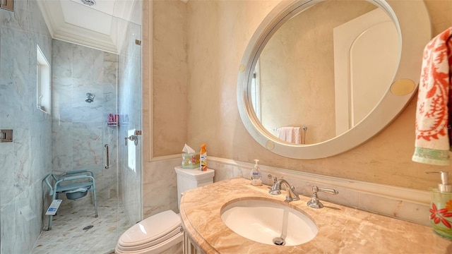 bathroom featuring walk in shower, vanity, tile walls, toilet, and crown molding