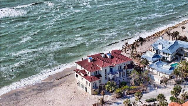 birds eye view of property featuring a water view and a view of the beach