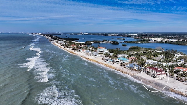 drone / aerial view with a view of the beach and a water view